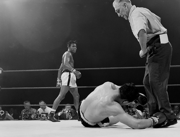 ugar Ray Robinson looks at Gene Fullmer after a knockout on May 1, 1957 at Chicago Stadium.